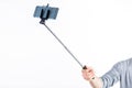 Casual man using a selfie stick Royalty Free Stock Photo
