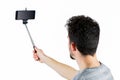 Casual man using a selfie stick Royalty Free Stock Photo