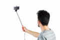 Casual man using a selfie stick Royalty Free Stock Photo
