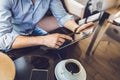 Casual Man Using Tablet Computer Sitting in Cafe Surfing Internet Royalty Free Stock Photo