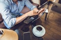 Casual Man Using Tablet Computer Sitting in Cafe Surfing Internet Royalty Free Stock Photo