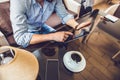 Casual Man Using Tablet Computer Sitting in Cafe Surfing Internet Royalty Free Stock Photo