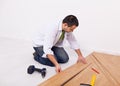Casual man or worker installing flooring Royalty Free Stock Photo