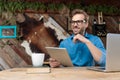 Casual man working on tablet while looking away happy Royalty Free Stock Photo