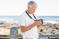 Casual mature man looking at his camera the sea Royalty Free Stock Photo