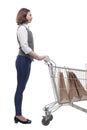 casual mature woman with shopping cart . isolated on a white Royalty Free Stock Photo