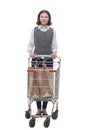 casual mature woman with shopping cart . isolated on a white Royalty Free Stock Photo