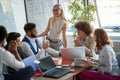 Casual meeting in bright conference room. multiethnic group of young business people. teamwork concept Royalty Free Stock Photo