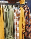 Casual mens shirts close-up hanging on hanger in a clothing store, hipster style