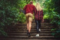 Casual moder young skateboarders couple posing on footway. Royalty Free Stock Photo