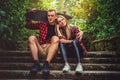 Casual moder young skateboarders couple posing on footway. Royalty Free Stock Photo