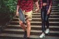 Casual moder young skateboarders couple posing on footway. Royalty Free Stock Photo