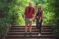 Casual moder young skateboarders couple posing on footway. Royalty Free Stock Photo