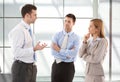 Casual office workers talking in hallway Royalty Free Stock Photo