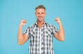 Casual and powerful. Strong guy flex arms blue background. Handsome man in casual style. Casual fashion trends. Fashion