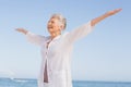 Casual senior woman with arms outstretched Royalty Free Stock Photo