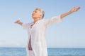 Casual senior woman with arms outstretched Royalty Free Stock Photo