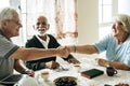 Casual seniors shaking hands refreshment Royalty Free Stock Photo