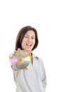 Casual smiling woman holding up compact disc or cd and looking Royalty Free Stock Photo