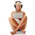 Casual student listening to music on the computer Royalty Free Stock Photo