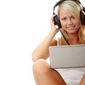 Casual student listening to music on the computer Royalty Free Stock Photo