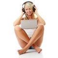 Casual student listening to music on the computer Royalty Free Stock Photo