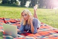 Casual student listening to music on the computer while studying Royalty Free Stock Photo