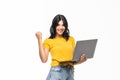 Young success girl on a laptop isolated over a white background Royalty Free Stock Photo