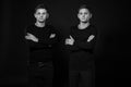 Casual twin brothers. Studio shot. Black and white photography