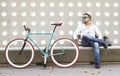 Casual urban cyclist resting
