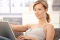Casual woman browsing internet at home Royalty Free Stock Photo
