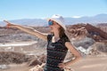 Casual woman enjoy solo trip and admire unique epic landscape of the Moon Valley, Chile Royalty Free Stock Photo