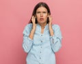 Casual woman feeling angrily surprised of what she sees