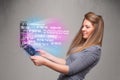 Casual woman holding laptop with exploding data and numers Royalty Free Stock Photo