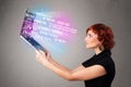 Casual woman holding laptop with exploding data and numers Royalty Free Stock Photo