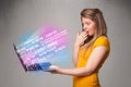 Casual woman holding laptop with exploding data and numers Royalty Free Stock Photo