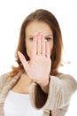 Casual woman making stop gesture. Royalty Free Stock Photo