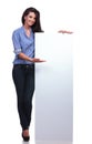 Casual woman presents a blank pannel Royalty Free Stock Photo