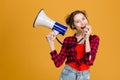 Casual woman screaming in megaphone Royalty Free Stock Photo