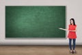 Casual woman showing empty chalkboard Royalty Free Stock Photo