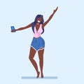 Casual woman taking selfie photo on smartphone camera young african american girl raising hand female cartoon character Royalty Free Stock Photo