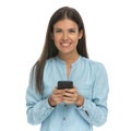 Casual woman texting a message on her mobile phone Royalty Free Stock Photo