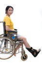 Casual woman in wheelchair with foot orthosis