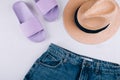 Casual women`s clothing, acccessories. Summer slippers, shorts, straw hat Royalty Free Stock Photo