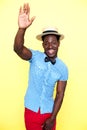 Casual young african guy posing with raised arm Royalty Free Stock Photo