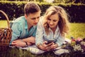 Casual young couple relaxing on a lawn. Royalty Free Stock Photo