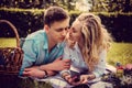 Casual young couple relaxing on a lawn. Royalty Free Stock Photo