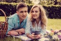 Casual young couple relaxing on a lawn. Royalty Free Stock Photo