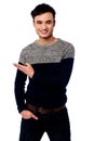 Casual young guy pointing away Royalty Free Stock Photo