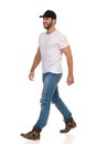 Walking Casual Young Man In Black Cap Royalty Free Stock Photo